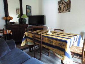 a living room with a table with a table cloth on it at Apartment Coecilia in Ax-les-Thermes