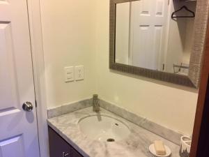 a bathroom with a sink and a mirror at Playa a pie Zona Dorada in Mazatlán +15 photos