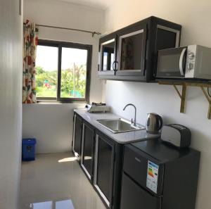 Kuchyň nebo kuchyňský kout v ubytování Luxe Exotica Apartments