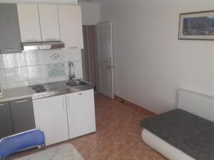 Kuchyň nebo kuchyňský kout v ubytování Apartments Erceg + 37 fotografií