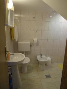 a bathroom with a toilet and a sink at Apartment Antonio in Šibenik