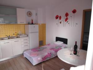 a small kitchen with a table and a small table with at Apartment Antonio in Šibenik