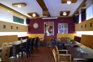 a dining room with tables and chairs in a restaurant at Reiterhof Sonja in Apetlon