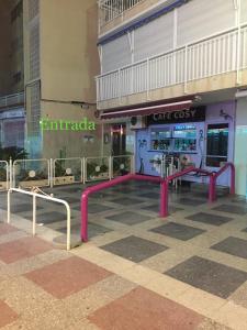 a playground in the middle of a building at La Gavina in Benidorm