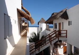 a view of the stairs to the beach from a building at Anacapri Suite - 4th Floor Penthouse Beach Front in Mahahual