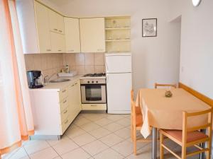 Kuchyň nebo kuchyňský kout v ubytování Apartments Ante-Gojko