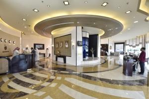 a lobby of a building with people in it at Awaliv International Hotel in Taif