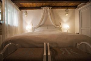 a bedroom with a bed with a canopy at Casa Vecia in Brtonigla