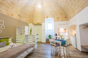 A bed or beds in a room at Dimora Antica Via MiLord