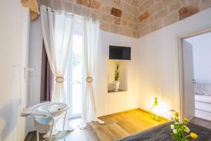 A bed or beds in a room at Dimora Antica Via MiLord