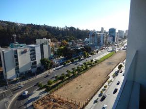 an aerial view of a city with a road and buildings at Dpto4u in Viña del Mar