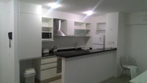 Kuchyň nebo kuchyňský kout v ubytování Arenas del Mar Apartments + 48 fotografií