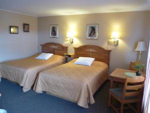 Voodi või voodid majutusasutuse Country Villa Motel toas