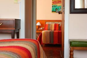 Cama ou camas em um quarto em Hotel San Martin