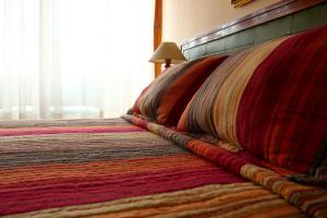Cama ou camas em um quarto em Hotel San Martin
