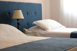 Cama ou camas em um quarto em Hotel San Martin