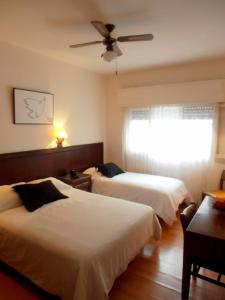 Cama ou camas em um quarto em Hotel San Martin