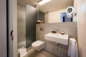 Baðherbergi á Boutique Hotel NI-MO