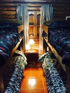 Una cama o camas en una habitación de Cabañas Sehuen