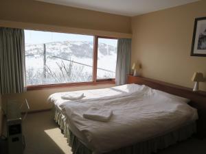 Tempat tidur dalam kamar di Sundeck Hotel