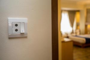 Postel nebo postele na pokoji v ubytování Hotel White Pearl
