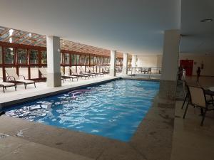 Swimmingpoolen hos eller tæt på Flat em Pedra Azul