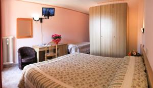 Postel nebo postele na pokoji v ubytování Hotel Les Saisons