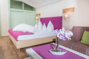 Łóżko lub łóżka w pokoju w obiekcie Hotel Sonnalm - SPA,Idyll,Dining