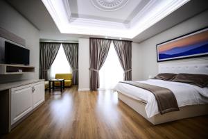 Postel nebo postele na pokoji v ubytování Hotel Vila Imperial