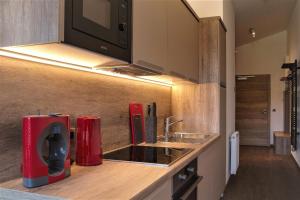 Kuchyň nebo kuchyňský kout v ubytování Appartements Onyx