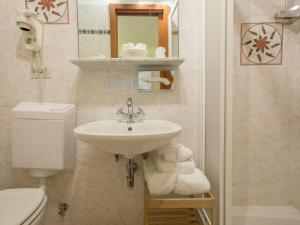 a bathroom with a sink and a toilet at Hotel Marina in Monterosso al Mare