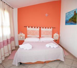 Postel nebo postele na pokoji v ubytování Casa Vacanza Porto Frailis già Porto Frailis B&B