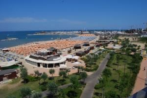 an aerial view of a beach with umbrellas and people at Residence Record in Rimini