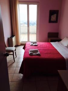 Posteľ alebo postele v izbe v ubytovaní Hotel Pellegrino E Pace