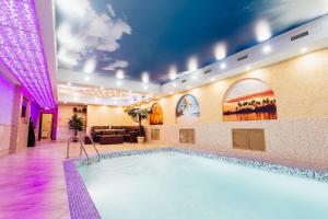 a large pool in a hotel room with at Golden Plaza Hotel in Tver