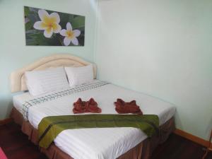 Rúm í herbergi á Phi Phi Coralbay