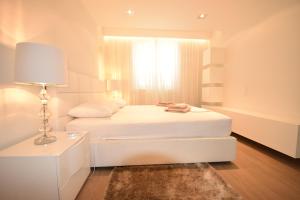 Ένα ή περισσότερα κρεβάτια σε δωμάτιο στο Apartments Lofiel