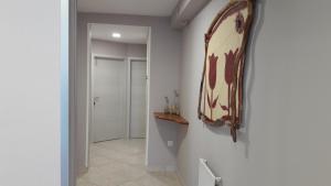 a bathroom with a mirror on the wall at Apartma & RAfting in Kobarid