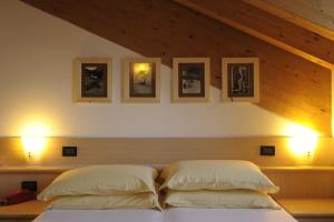 Postel nebo postele na pokoji v ubytování Alpstyle Hotel Albolina Wellness & Beauty
