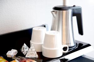 Příslušenství pro přípravu čaje a kávy v ubytování Best Western Hotell Ett