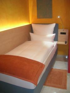 En eller flere senge i et værelse på Casa Andelka