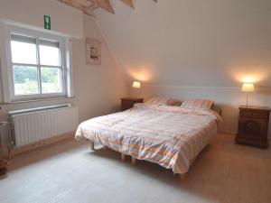 A bed or beds in a room at Villa with large fenced garden near Bruges and the forest