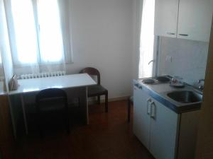 Kuchyň nebo kuchyňský kout v ubytování Residence Rotonda