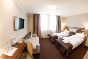 Ένα ή περισσότερα κρεβάτια σε δωμάτιο στο Hotel Diament Zabrze - Gliwice