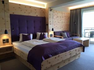 Łóżko lub łóżka w pokoju w obiekcie Hotel Streklhof