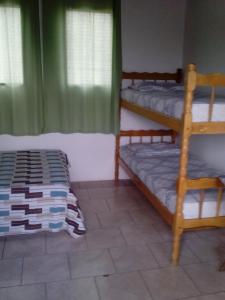 Postel nebo postele na pokoji v ubytování Hotel Pousada Guaratuba