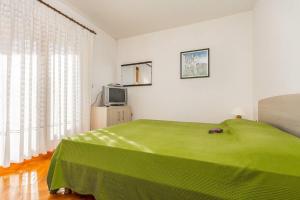 Postel nebo postele na pokoji v ubytování Apartments Valbandon
