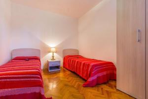 Postel nebo postele na pokoji v ubytování Apartments Valbandon