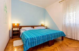 Postel nebo postele na pokoji v ubytování Apartments Danilo