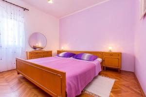Postel nebo postele na pokoji v ubytování Apartments Danilo